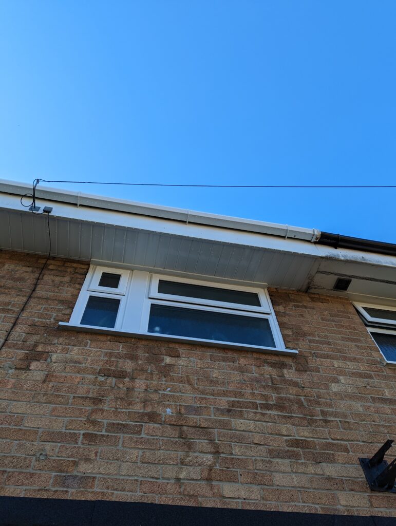 looking up at a clean soffit , fascia and gutter